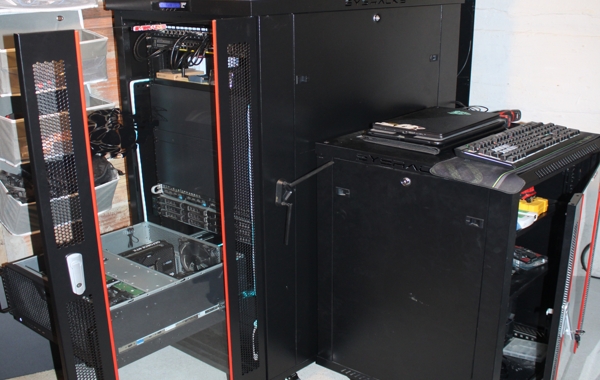 Open server computer tower undergoing internal equipment maintenance and storage upgrades
